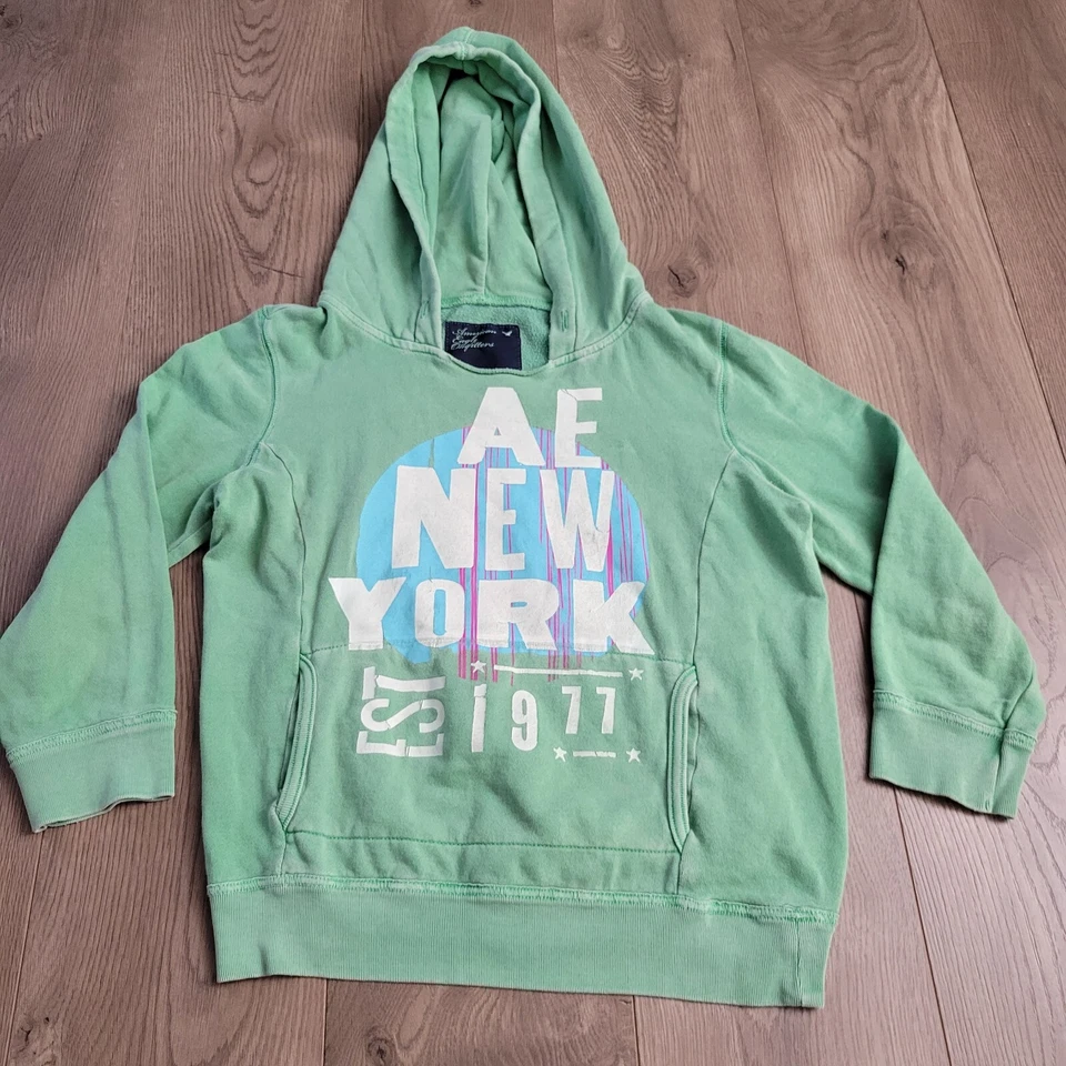 Sudadera American Eagle Mujer Mediana Verde Sudadera con Capucha Nueva York Destino Polar Foto 2 de 4