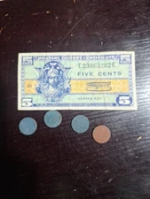 U.S. Military Payment Certificate (MPC) and several coins.