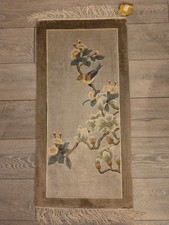 A Chinese Art Deco rug with birds and flowers on a mauve background 95x45cm