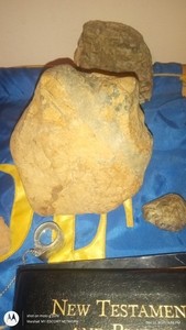 quartz skull and a rock mommiefied skull of achent mankind