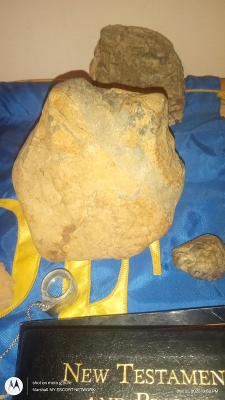 quartz skull and a rock mommiefied skull of achent mankind