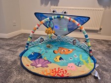 Baby play gym with lights, music and a detachable sensory toys