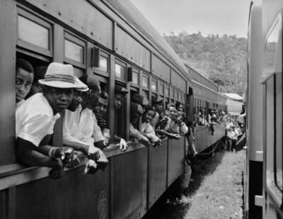 Crowded train passengers leaning out windows West Indies circa 1955 Old Photo