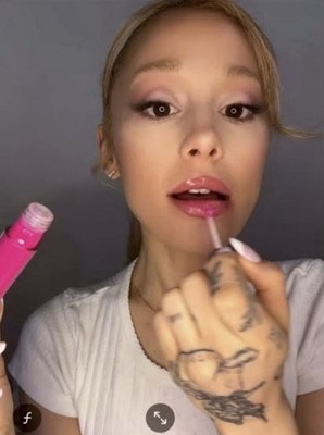 Lip GlossR.E.M.  by Ariana Grande  Color -Topless - Long Lasting & Plumping
