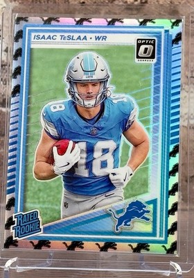 2025 Panini Optic Rated Rookie Isaac Teslaa #219 Lions Team Emoji /32 Lions
