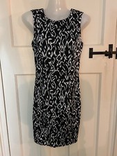Beautiful satin feel fitted Zara dress with cut out back, black base,hardly worn