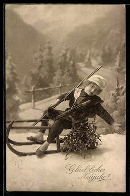 Postcard Child with Mistletoe on a Sleigh 