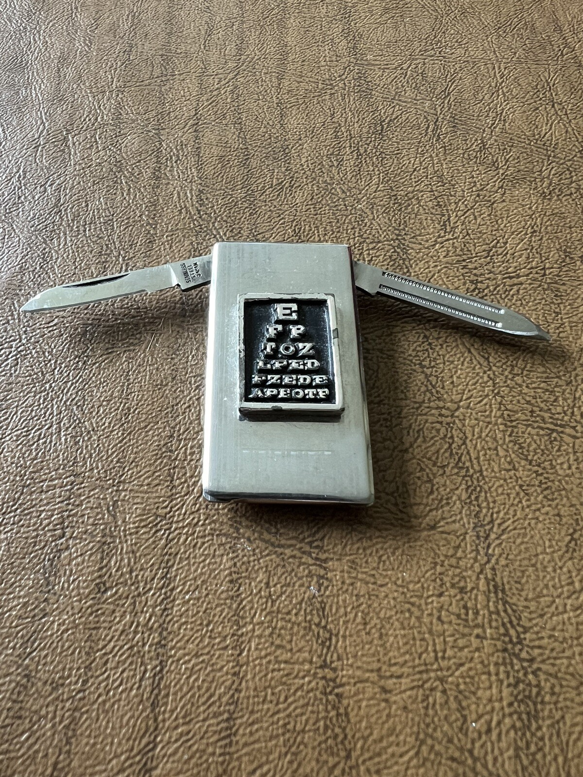 Vintage Stainless Steel Optician Eye Chart Money Clip with Knife and File-image