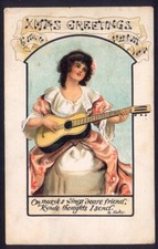 Pretty Girl Strums Guitar to Send You Xmas Greetings. Vintage Art Postcard