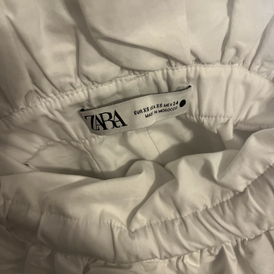 Top corto ZARA de algodón blanco fuera del hombro con lazo delantero talla XS Foto 3 de 4