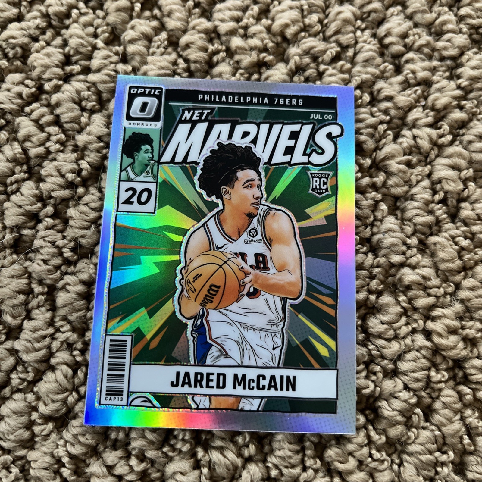 Jared McCain 2024-25 Panini Donruss Optic Net Marvels Holo Prizm RC #23
