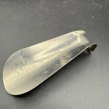 Metal advertising shoehorn from 'The Florsheim Shoe Shop'