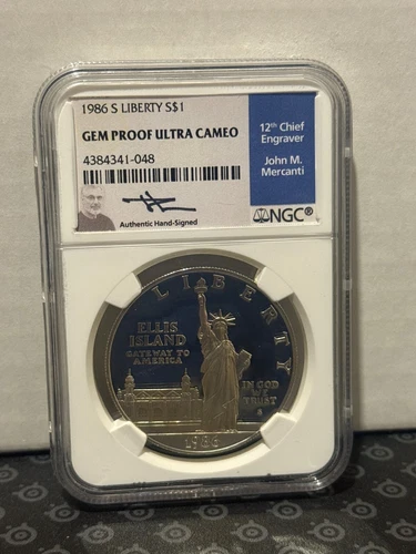 1986-S – Gem Proof Ultra Cameo Statue of Liberty Dollar in Slab NGC – SIGNED