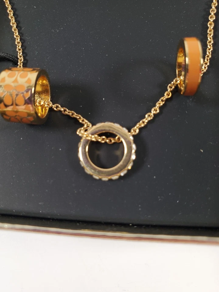 Auténtico Collar Coach Rondell 3 Anillos Pavé Diamantes Motivo Círculo Dorado/Rosa Foto 4 de 4