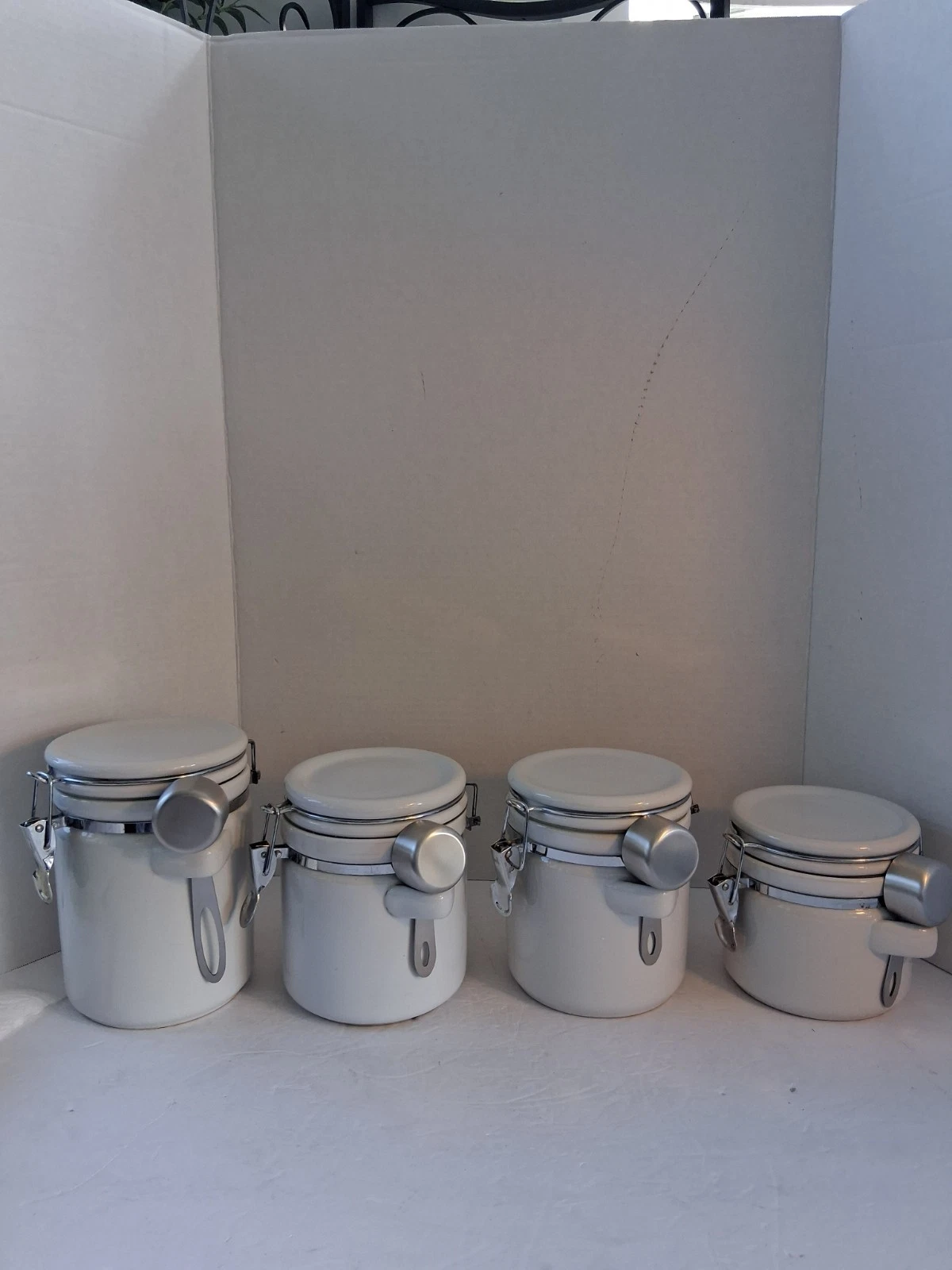 OGGI 8-Piece White Canister Set; 4 Ceramic Airtight Seals Canisters; 4 Scoops