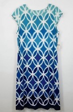 Blue and white geometric patterned top with diamond and oval shapes