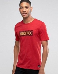 red black and gold nike shirt