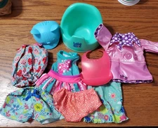 Baby Alive , Potty,  bib, strawberry clothes, hat, coat and more.