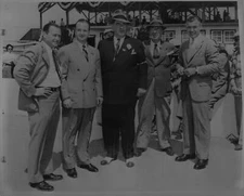 Clark Gable stands with Wilbur Shaw, Benson Ford, Seth Klein, a 1950 Indy Photo