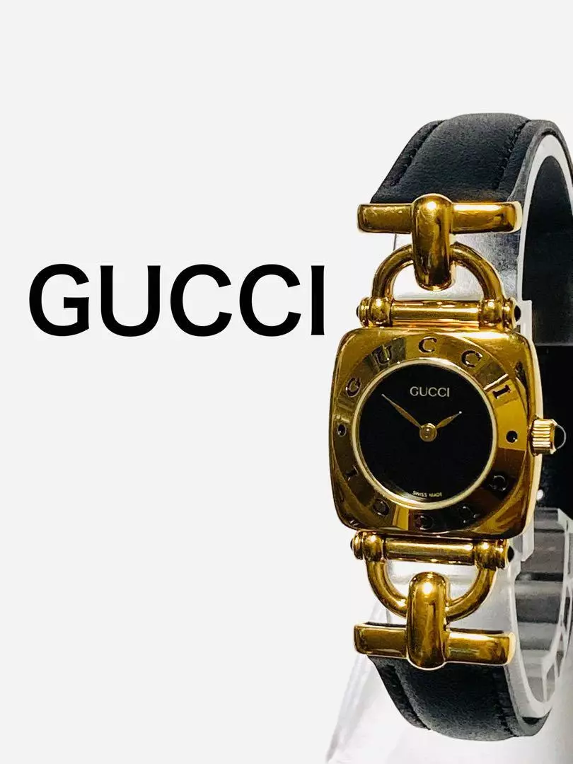 Montre Gucci vintage noire dorée fonctionne du Japon