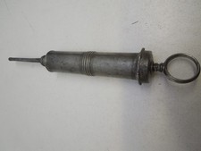 Antique medical syringe, pewter? 9"
