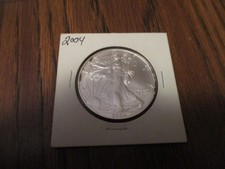2004 SILVER AMERICAN EAGLE 1 OUNCE .999 SILVER SOME TONING ON THE RIM
