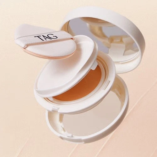 White TAG Skin Fit Cover Balm 12g #01 light beige foundation with separate round white applicator in a beige shower room.