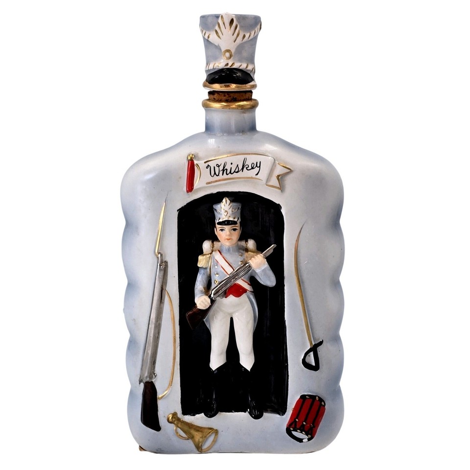 A ceramic Shields Fifth Avenue soldier whiskey decanter with a 3D stopper, made in Japan — absurdly specific and delightfully weird vintage barware.