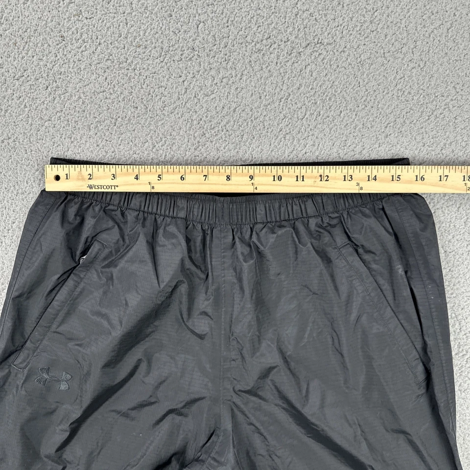 Pantalones deportivos Under Armour de nailon cortavientos para hombre grandes negros con cremallera al tobillo ligeros Foto 4 de 4