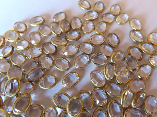 50 Swarovski Channel Oval Rhinestones 8x6mm Crystal/ Brass settings.