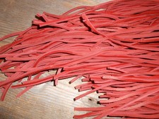 One pair of 34" long 1/8" wide Red rawhide leather boot / shoe laces.