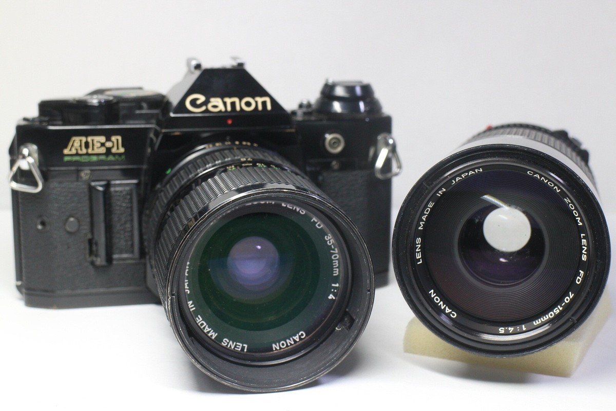 Canon AE-1 Program Film Camera + FD 35-70mm F/4 + 70-150mm F Canon AE-1 Program Film Camera + FD 35-70mm F/4 + 70-150mm F