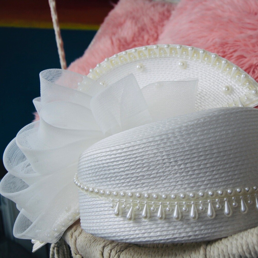 Vintage elegant white hat with decorative pearls and … Gem