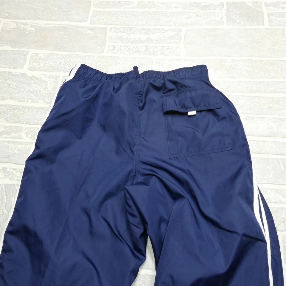 Pantalones deportivos tejidos de colección para hombre azules medianos forrados de poliéster con cremalleras al tobillo Foto 4 de 4