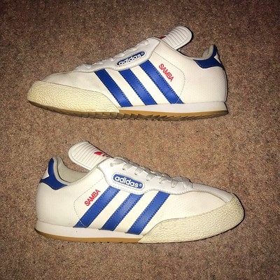 white and blue adidas samba