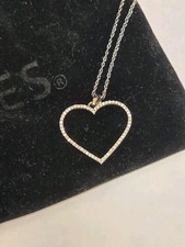 1/8 CT. T.W. Diamond Heart Outline Pendant in 10K White Gold