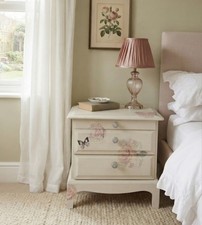 Stag Minstrel beside cabinet with 2 drawers & pullout tray painted in cream