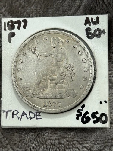 1877-P Silver TRADE DOLLAR.  Low AU with nice toning.