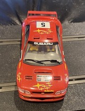 Brand new and in Mint Condition - SCALEXTRIC Red Subaru Impreza WRC No. 5