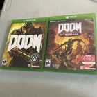 2 Xbox One Games: Doom And Doom Eternal. Completer In Cover