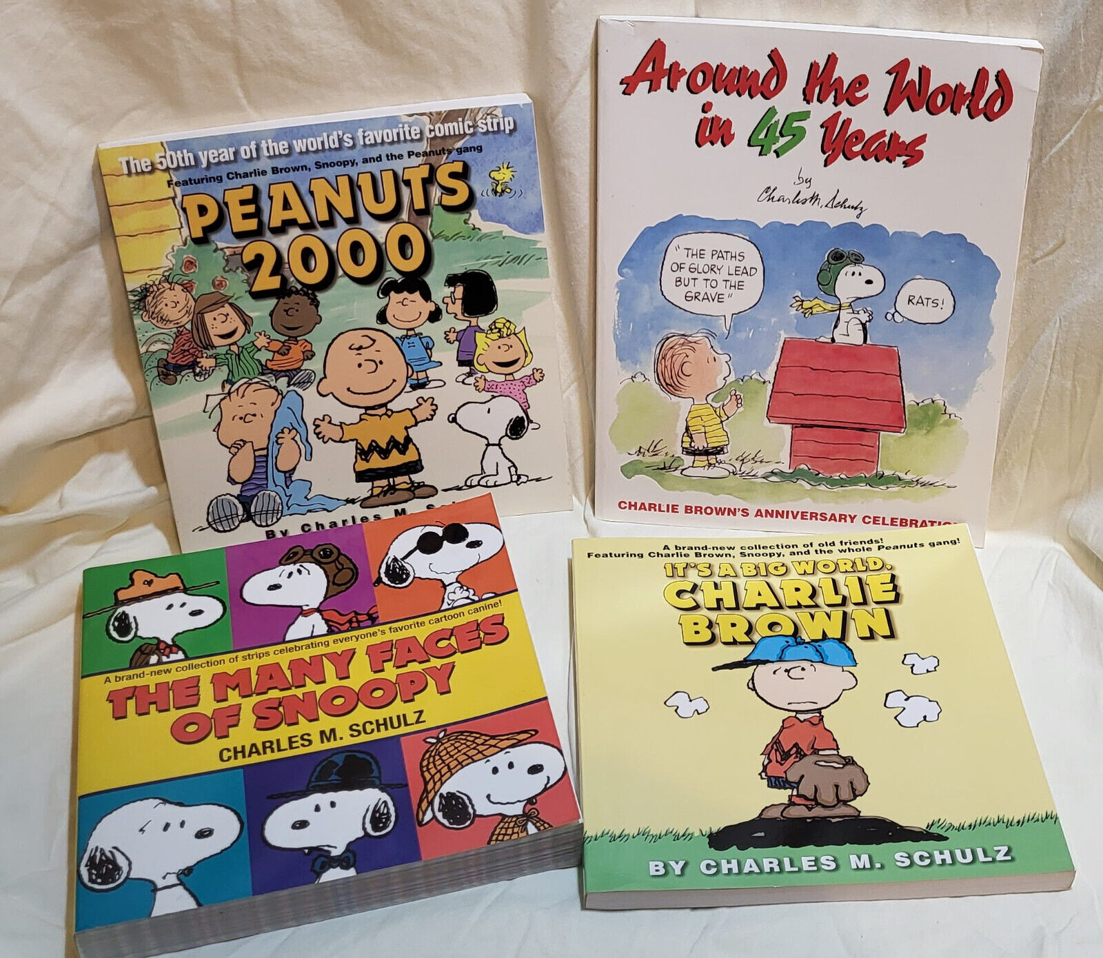 Lot of 4 Peanuts Charlie Around the World, Peanuts 2000, Many Faces, A Big World