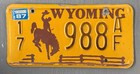 Vintage 87 WY License Plate Wyoming Lic Yellow Brown Cowboy 17 988 AF — photo 1