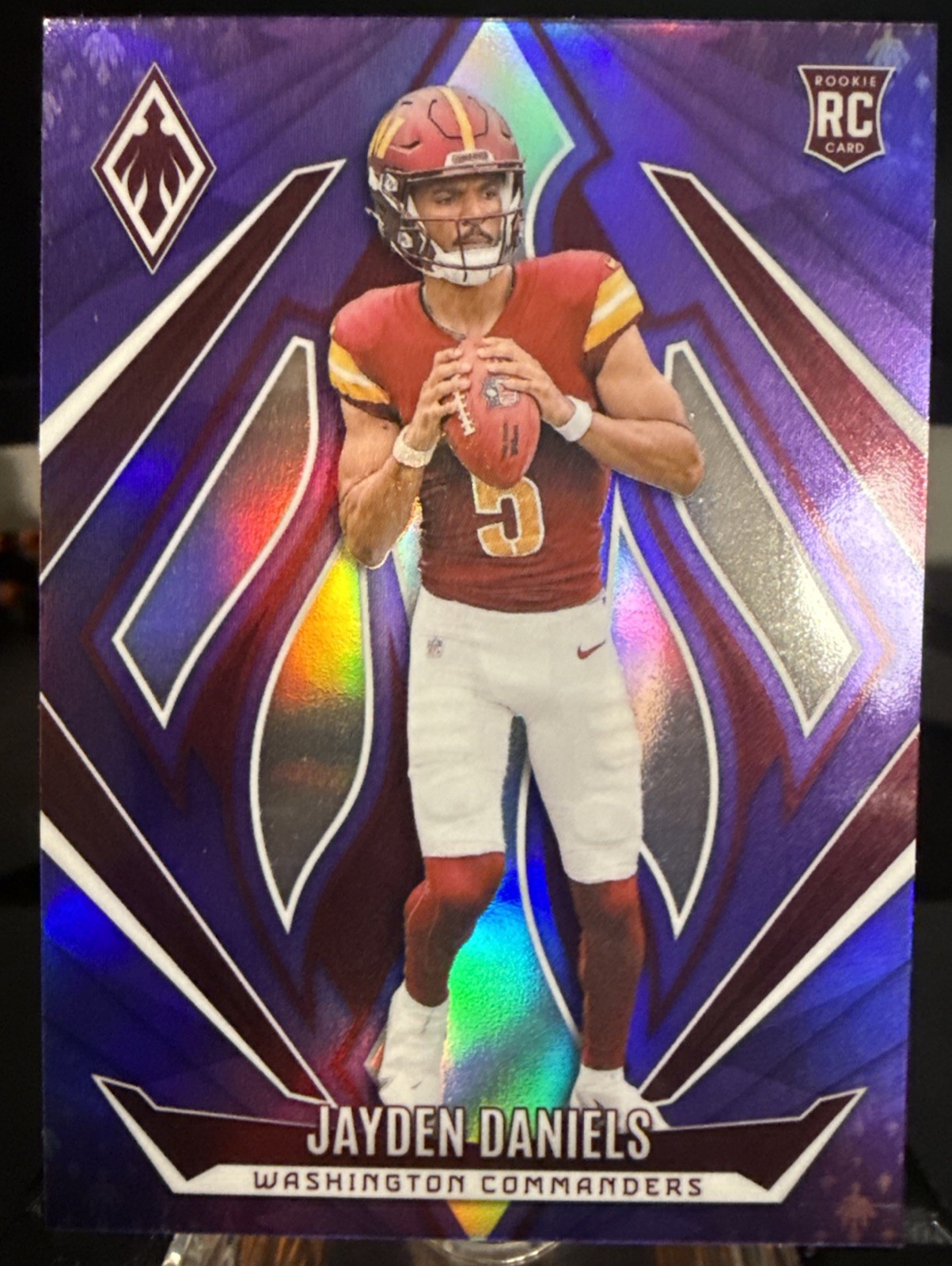 2024 Panini Phoenix - Rookies Jayden Daniels #198 Purple (RC)