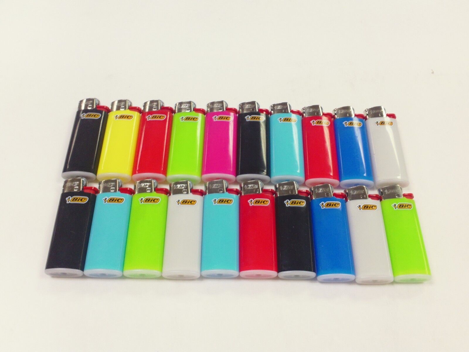 New 20 MINI BIC LIGHTER ASSORTED COLOR OR DESIGN SMALL BIC WITH FLUID NOT REFILLABLE.