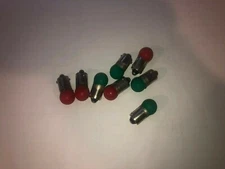 LIONEL PARTS, 53 , 12-16  VOLT BAYONET BULB, LOT OF 8 , 4 RED & 4 GREEN