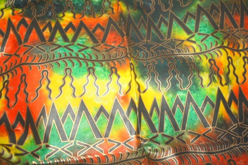 METALLIC GOLD AND BLACK TRIBAL MOUNTAIN AFRICAN DESIGN ON MULTICOLORED BATIK