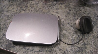 2012 NISSAN JUKE Fuel Tank Door Chrome Silver Metallic Paint Code KYO CHIP BLEM