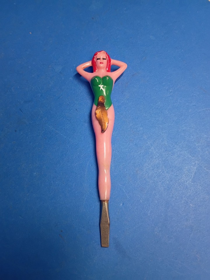 A 1950s novelty screwdriver shaped like a pin-up girl — a genuinely hilarious and visually striking piece of mid-century Americana that doubles as a functional tool.