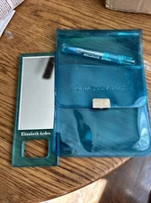 Elizabeth Arden travel mirror and brush. NEW With Plastic Snap Case !