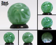 5/8" Translucent Green Marble with white ribbons busy pattern NM